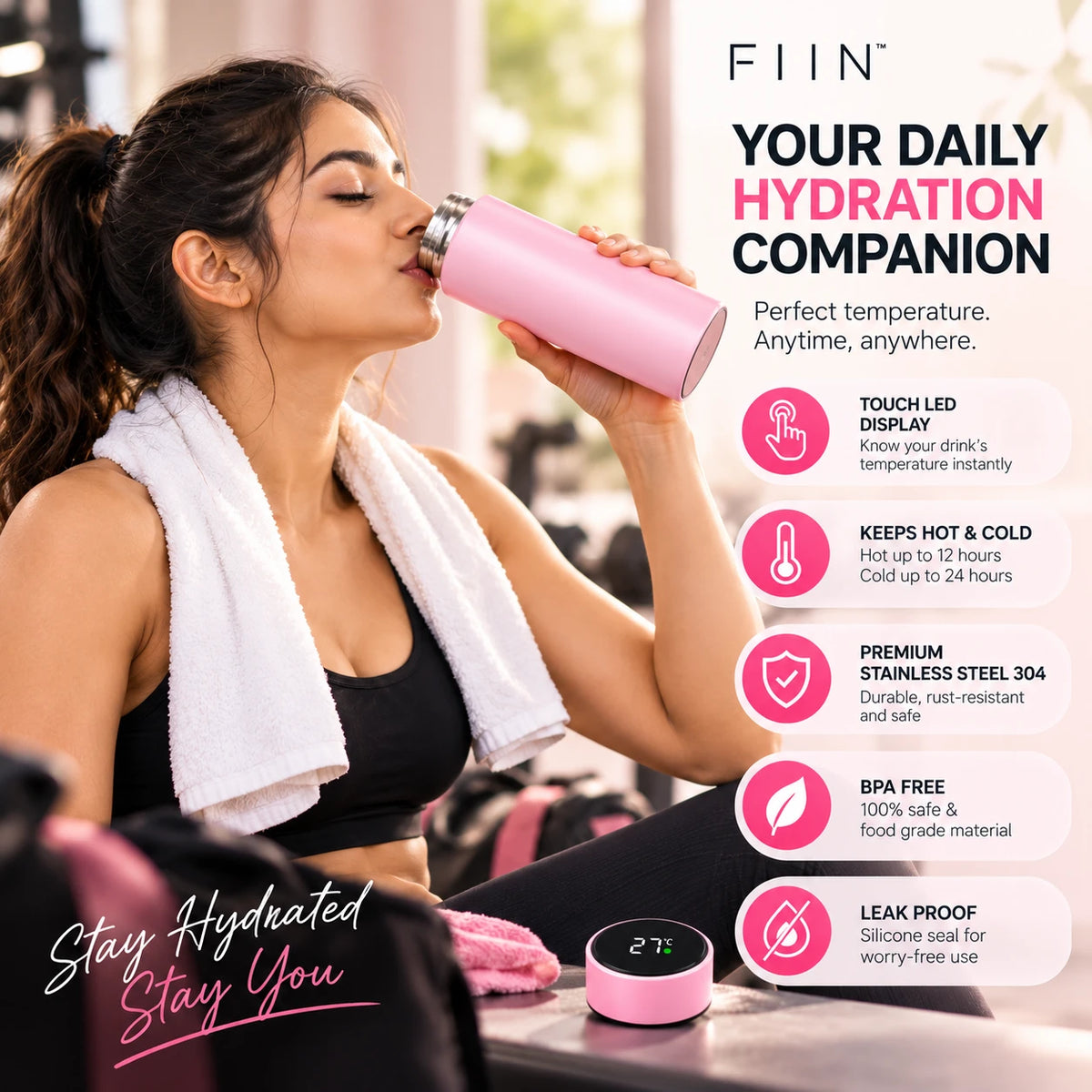 Woman drinking from the pink bottle at the gym